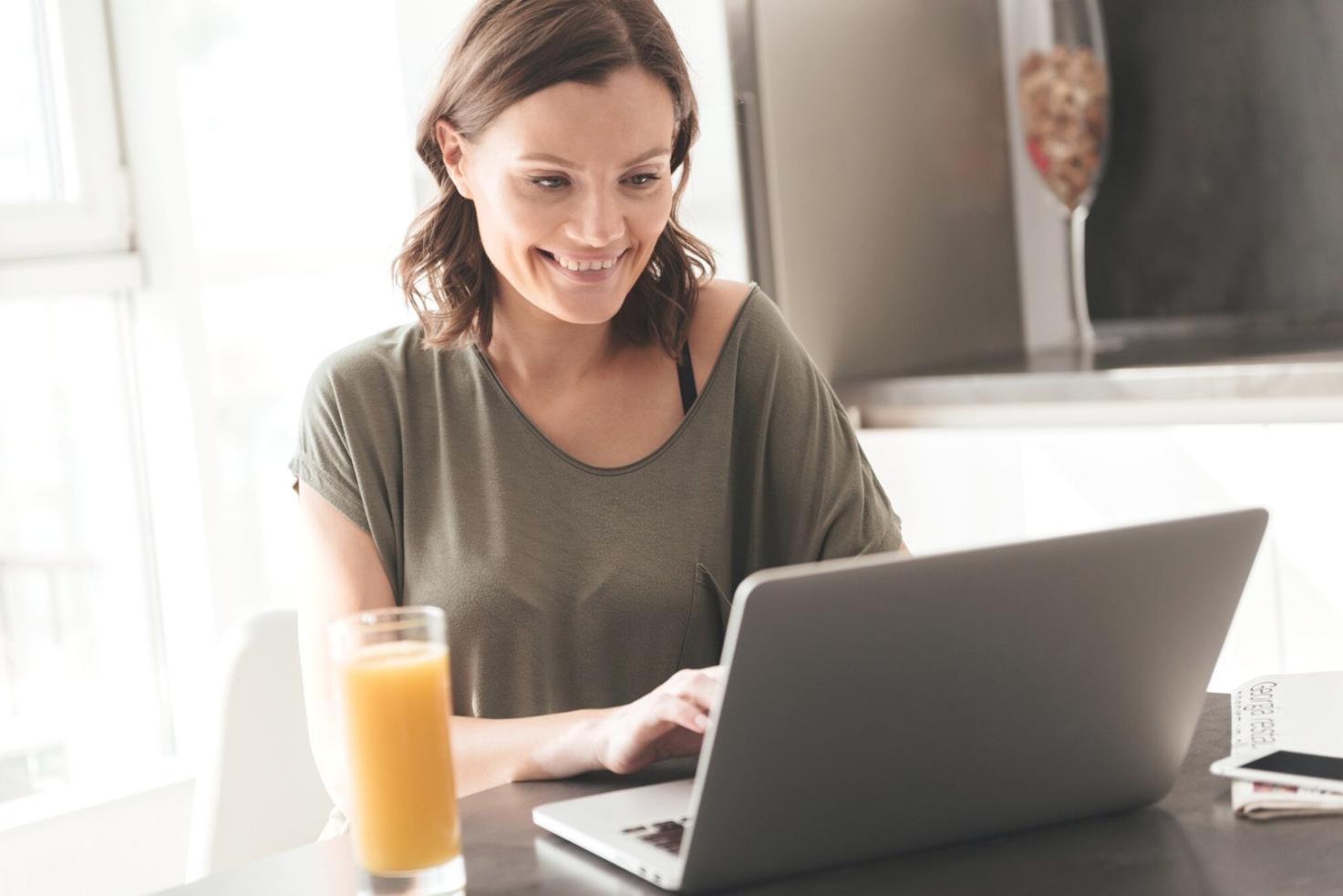 Person reviewing investment documents at home workspace